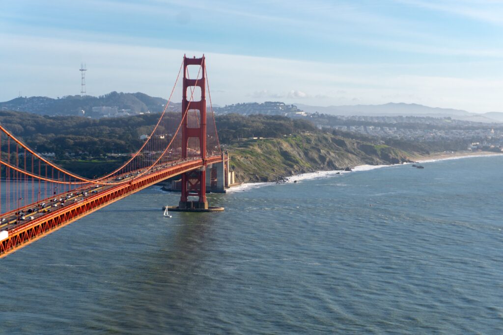 Aerial view of the Golden Gate Bridge spanning San Francisco Bay on a clear day.